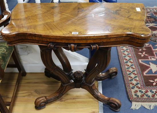 A Victorian walnut card table, W.3ft